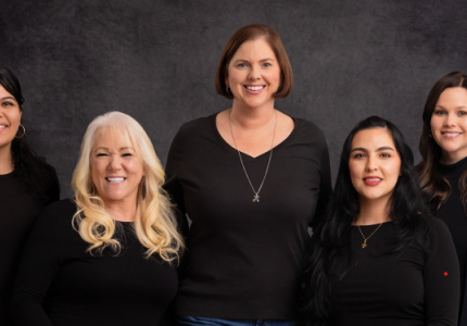 5 team members smiling