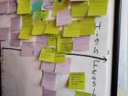 Community organizations add sticky notes of local priorities as part of an exercise to develop action items for the CWPP 