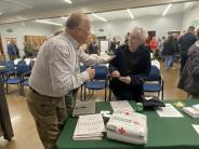 Commissioner Will Tucker talking with a constituent at Wildfire Ready Night 