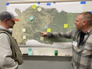 Oregon Department of Forestry officials reviewing community priorities at Wildfire Ready Night 