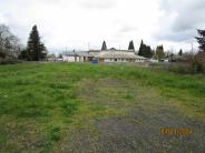 Photo of 645 W B St., Lebanon, Oregon. The property is a bare lot.