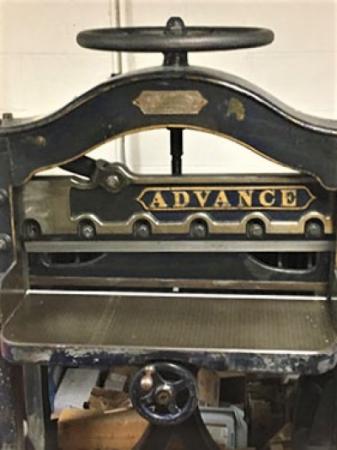 Photo of antique paper cutter.