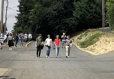 Boys walking down street.