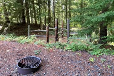 firepit with corrals in the background